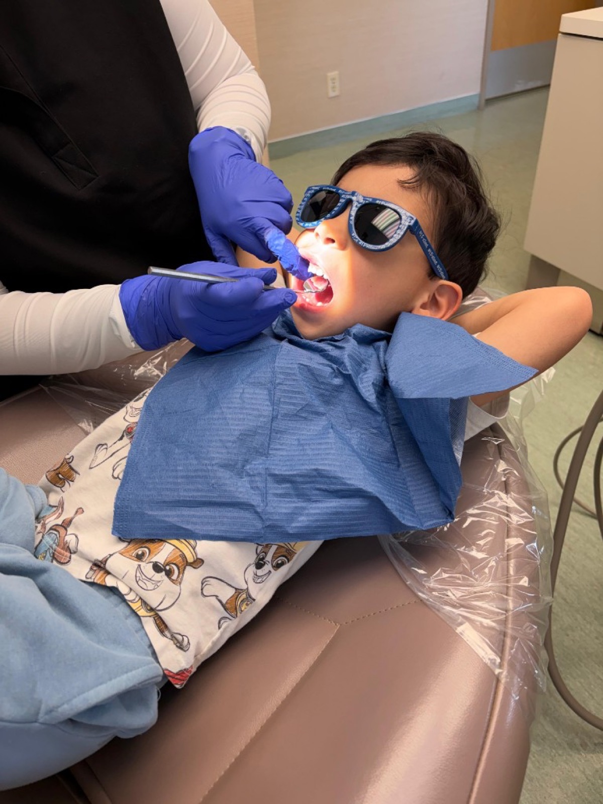 Young patient receiving a gentle dental exam at North York Dental