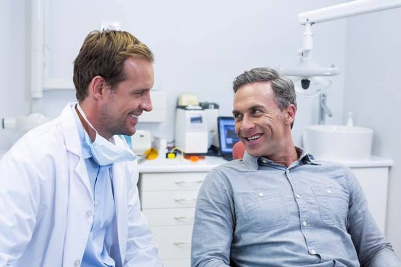 North York dentist and patient discussing dental bridges