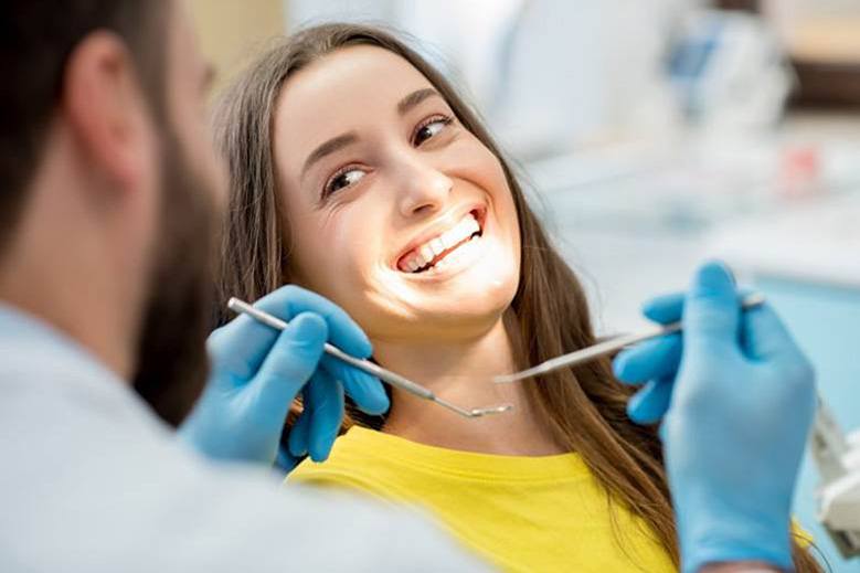 Smiling patient getting tooth-coloured fillings in North York