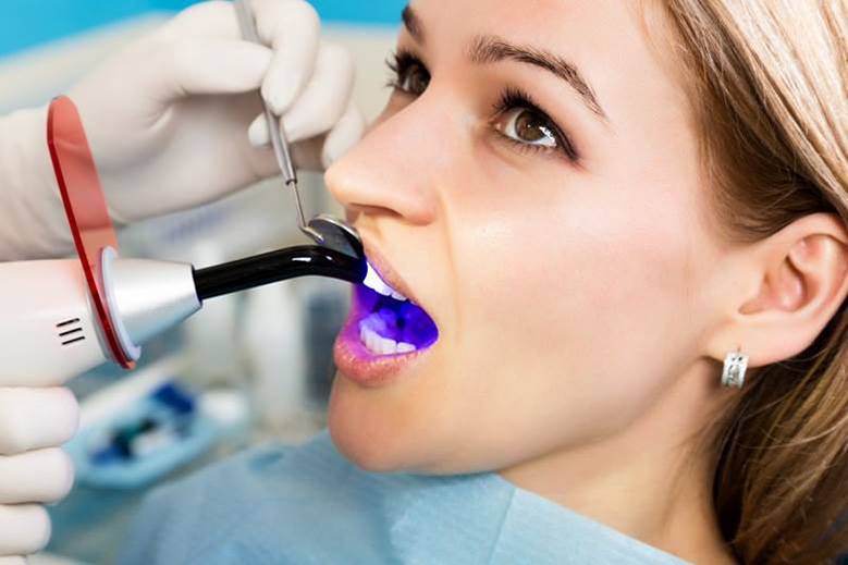 woman getting dental bonding from her cosmetic dentist in North York