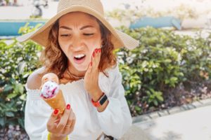 woman experiencing sensitivity with veneers