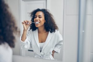 patient brushing their teeth